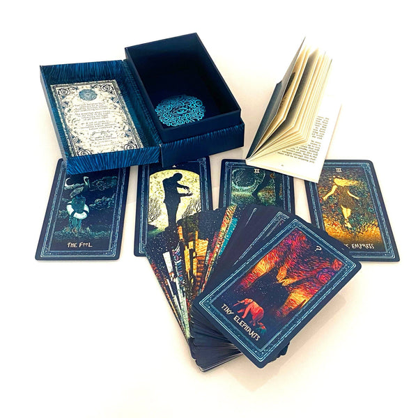 Opened box and fanned out deck of Prisma Visions tarot cards